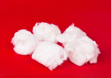 Medical cotton on a red backgroundの写真素材