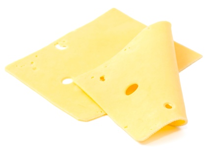 sliced cheese on a white backgroundの写真素材