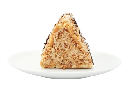 piece of cake with nuts on white backgroundの写真素材