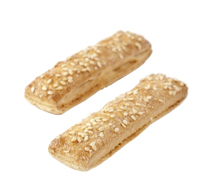 cookies with sesame seeds on a white backgroundの写真素材