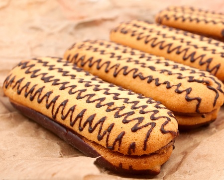 cake with chocolate icing on paperの写真素材