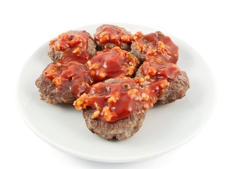 chops with sauce on a white background