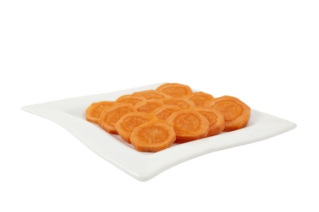 carrots cut into circles on a white backgroundの写真素材