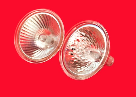 halogen light bulbs on a red backgroundの写真素材