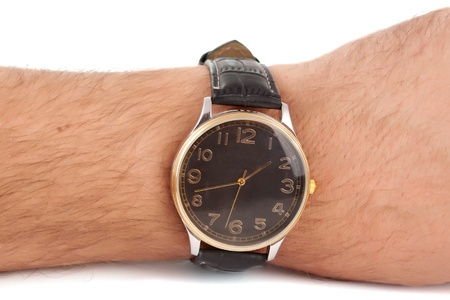 hand to the clock on a white backgroundの写真素材