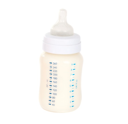 baby bottle with milk on white backgroundの写真素材