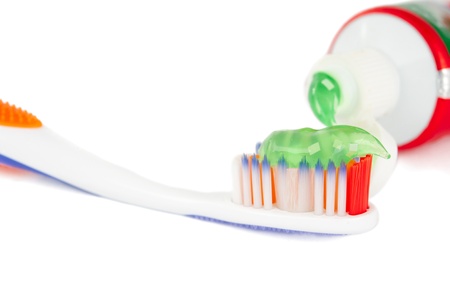 toothbrush with toothpaste on a white background