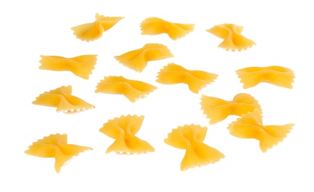Heap Farfalle pasta isolated on white background. Pasta is a staple food of traditional Italian cuisine.の写真素材