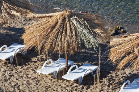 deck chairs on the beachの写真素材