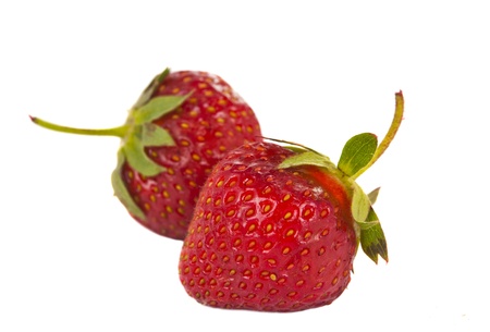 ripe strawberries isolated on white backgroundの写真素材