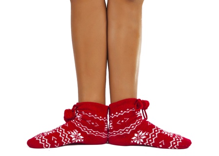 legs female in striped socks isolated on white backgroundの写真素材