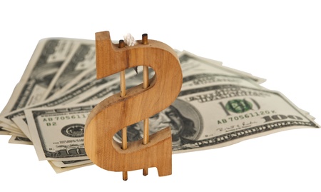 wooden dollar sign with dollars isolated on white backgroundの写真素材