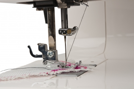 Fragment of the electric sewing machine isolated on white backgroundの写真素材