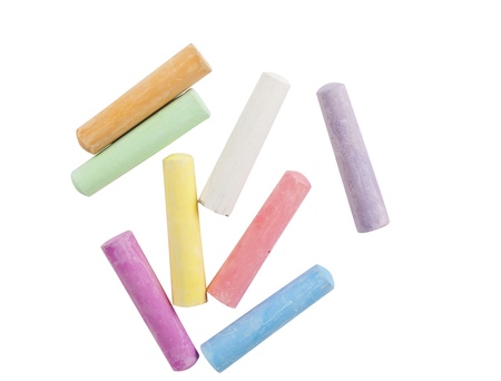 chalks in a variety of colors arranged on a white backgroundの写真素材