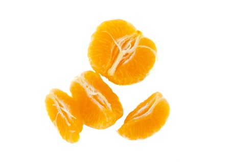 Tangerine slices isolated on white backgroundの写真素材