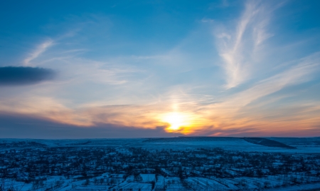 Beautiful winter sunset landscape on a hillの写真素材