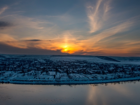 Beautiful winter sunset landscape on a hillの写真素材