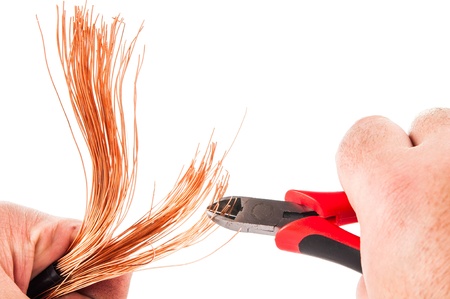 copper wire with pliers isolated on white backgroundの写真素材