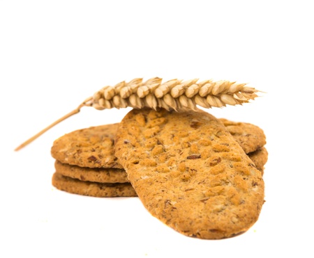 biscuits with ears of wheat on a white backgroundの写真素材