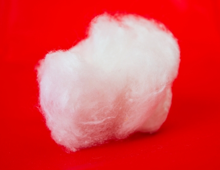 cotton wool on a red backgroundの写真素材