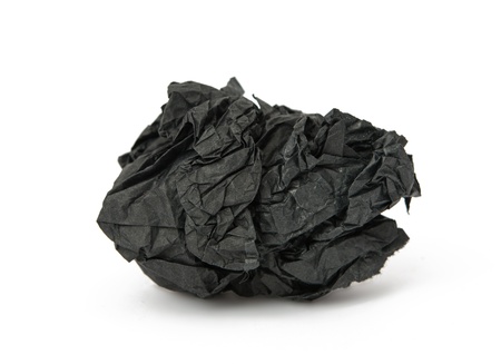 black crumpled paper isolated on white backgroundの写真素材