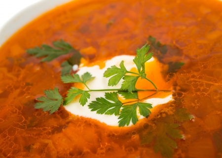 soup with sour cream on a white backgroundの写真素材