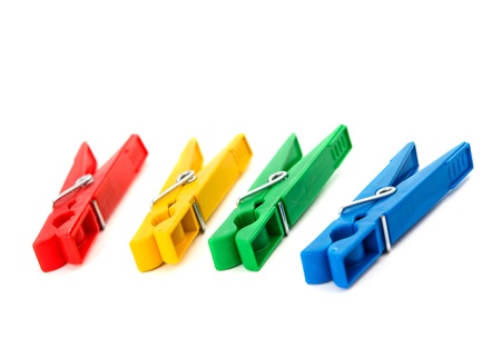 Closeup image of colorful clothespins isolated on a white backgroundの写真素材