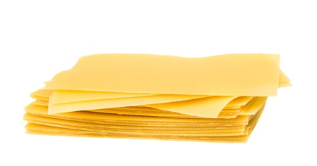 Uncooked lasagna pasta isolated on white backgroundの写真素材