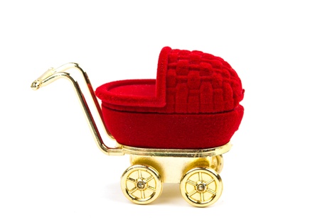 toy baby carriage isolated on white backgroundの写真素材