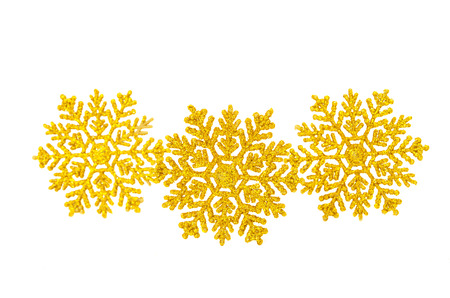 Golden snowflake isolated on white の写真素材