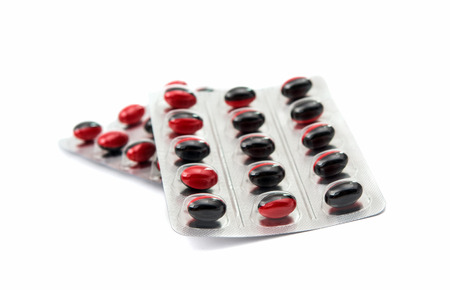 Medicine pills packed in blisters isolated on white background