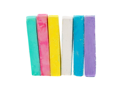 chalks in a variety of colors arranged on a white background