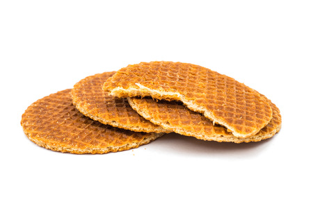 Dutch waffle called a stroopwafel on a white backgroundの写真素材