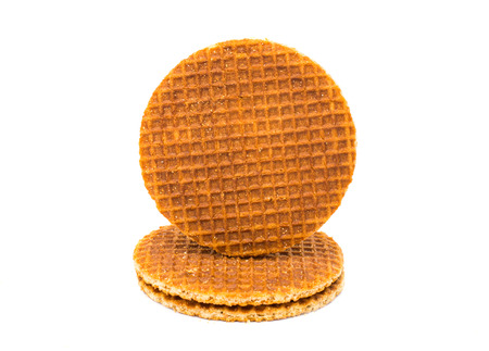 Dutch waffle called a stroopwafel on a white backgroundの写真素材