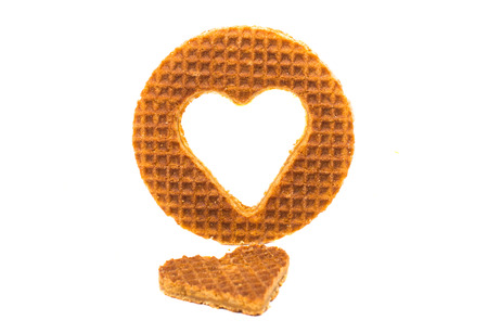 Dutch waffle called a stroopwafel on a white backgroundの写真素材