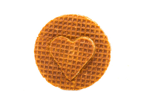 Dutch waffle called a stroopwafel on a white backgroundの写真素材