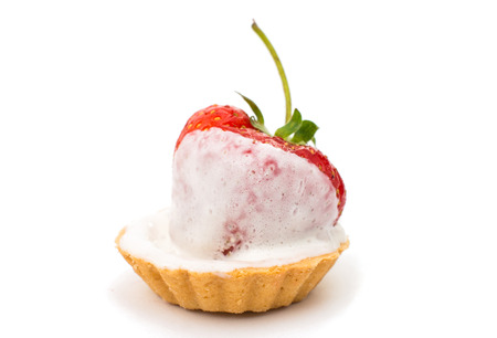Tasty tartlet with strawberries isolated on whiteの写真素材