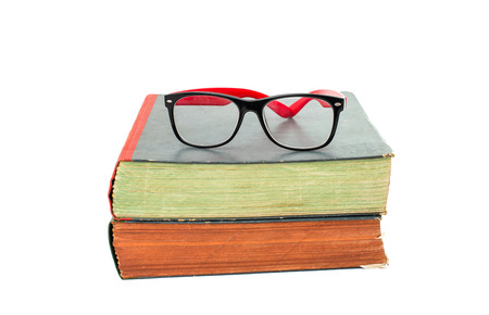 books with glasses on white backgroundの写真素材