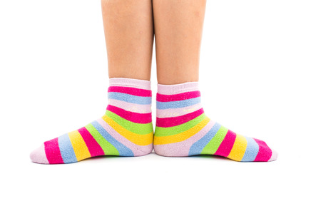 striped socks on the feet isolated on white background