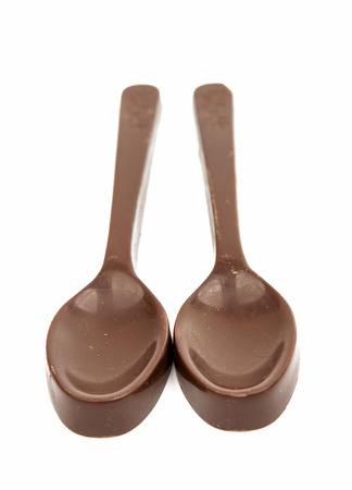 chocolate spoon on a white backgroundの写真素材