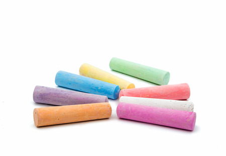 colored chalks on a white backgroundの写真素材