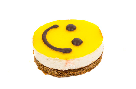 Smiley cake on a white backgroundの写真素材