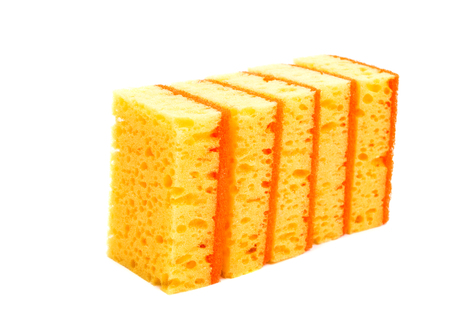 Yellow kitchen sponge isolated on white backgroundの写真素材