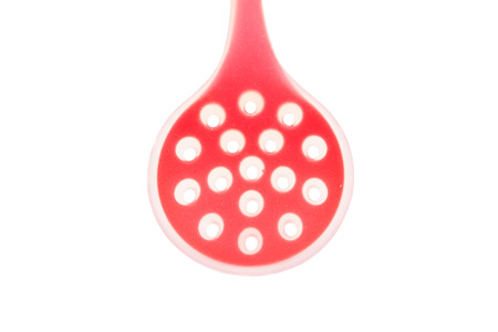 Red kitchen tool on a white backgroundの写真素材