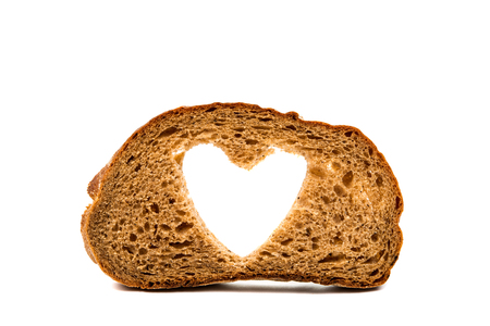 black bread with a heart on a white backgroundの写真素材