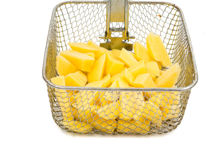 fried potatoes and frying pan basket on a white backgroundの写真素材