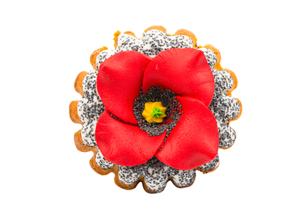 cupcake sprinkled with poppy seeds with a flower on a white backgroundの写真素材