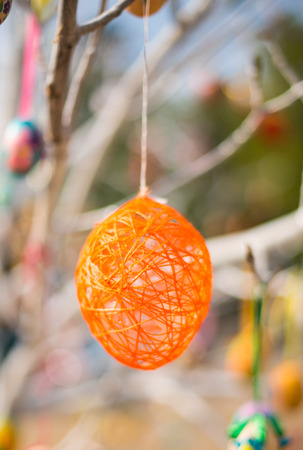 Easter egg on the branch of a tree