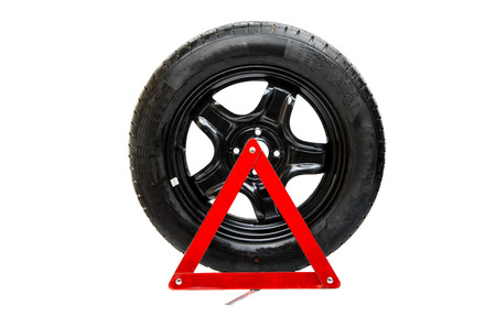 automotive wheel with an emergency sign on a white background