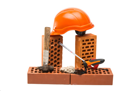bricks on a white background with construction accessoriesの写真素材